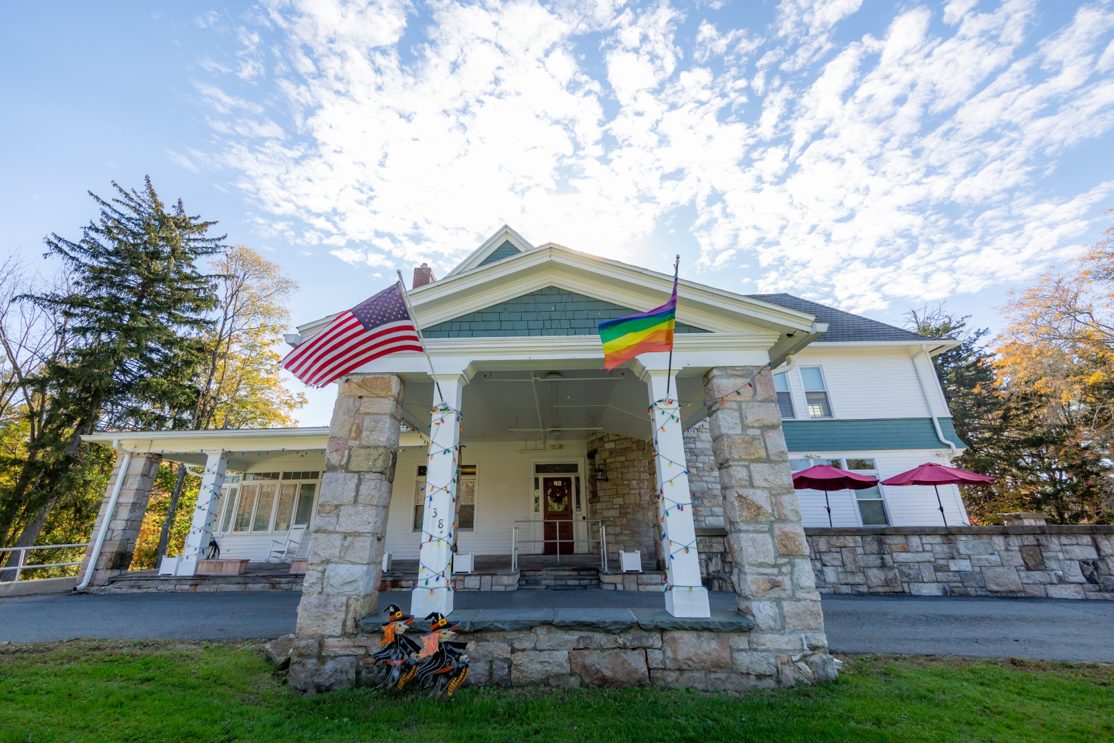 Front of house with flags waiving