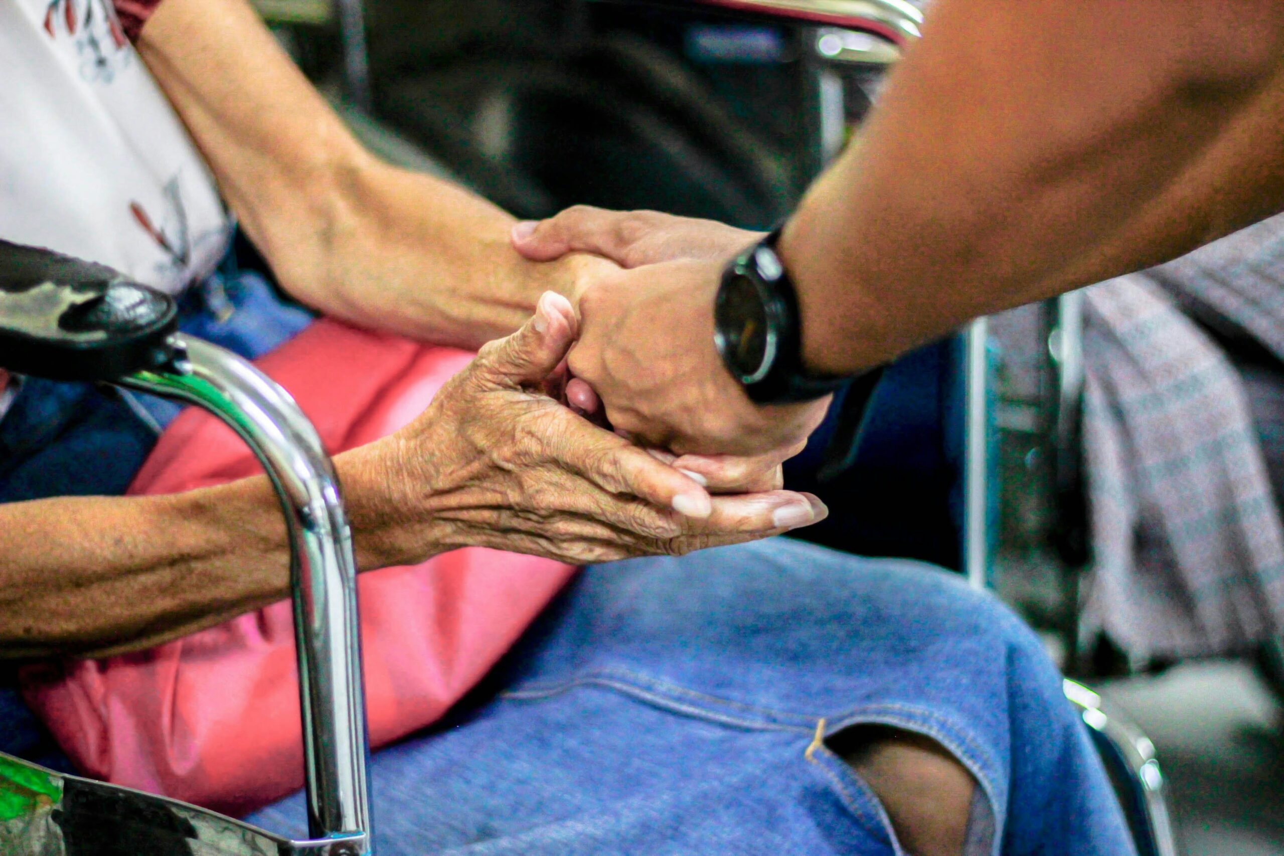 A person giving a hand to another in need