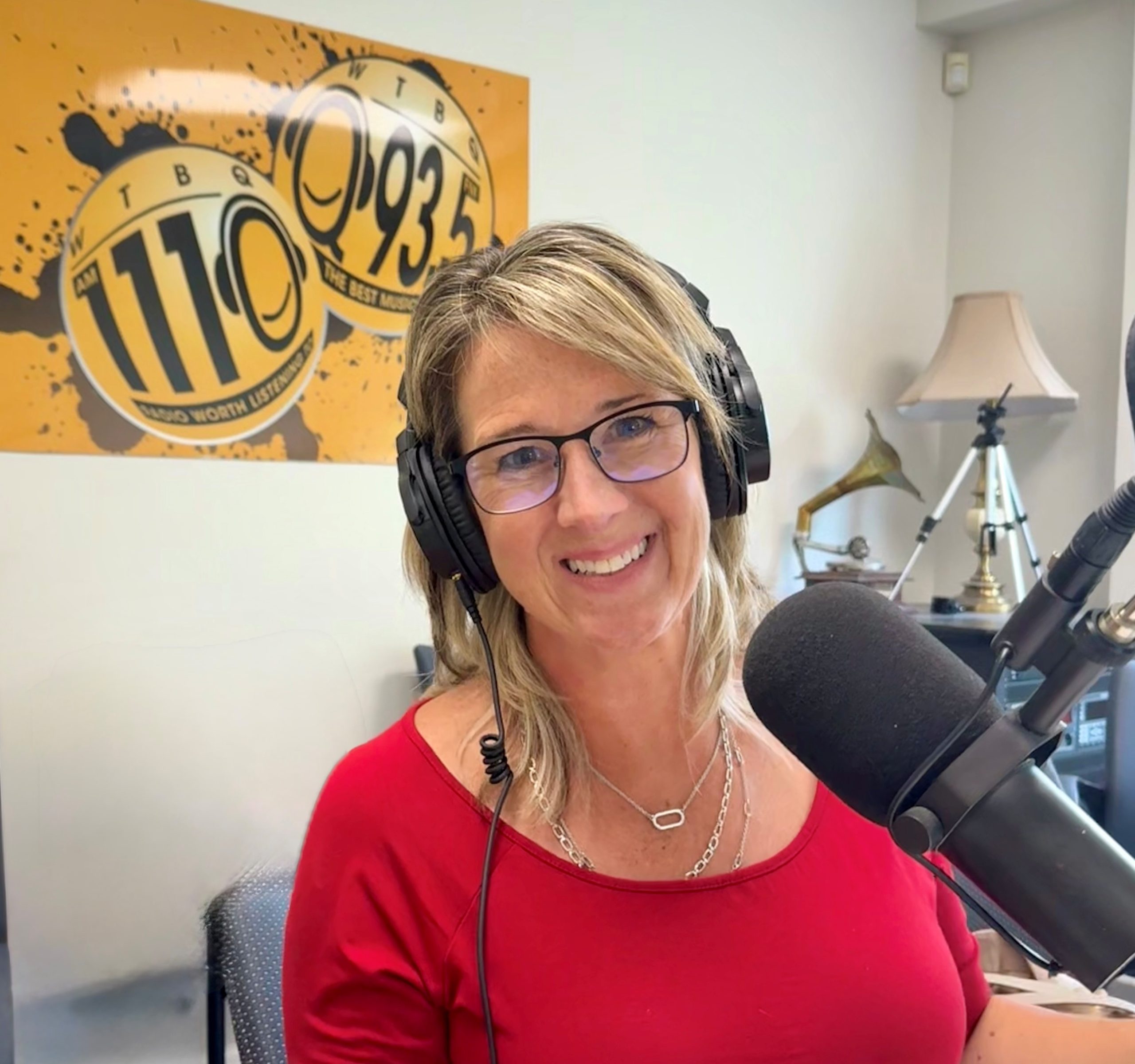 Cathy Parlapiano in front of a microphone