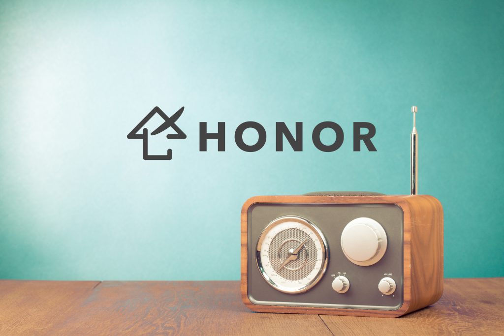 Retro style radio receiver on table front mint green background