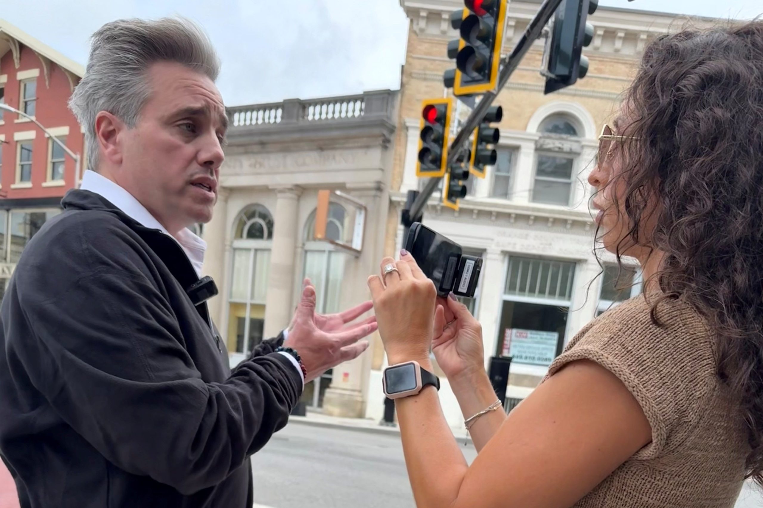 Two people speaking outside in the town of Middletown