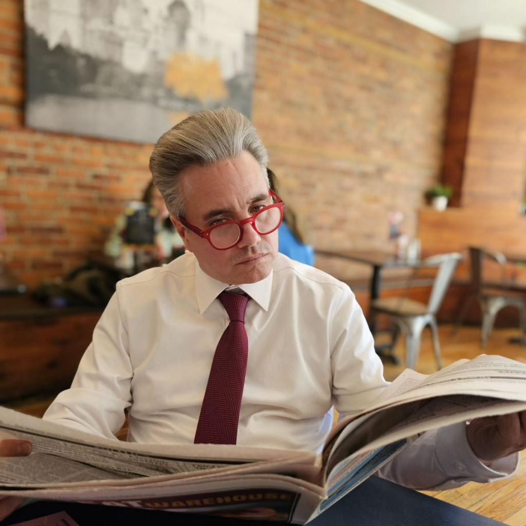 Man sitting reading the newspaper
